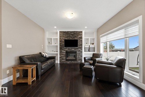 182 Woodhill Lane, Fort Saskatchewan, AB - Indoor Photo Showing Living Room With Fireplace