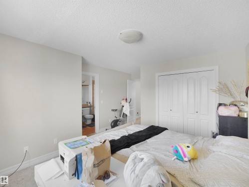 Neutral wall paint, white trim, recessed lighting, and a bi-fold closet - 17127 126 Street Nw, Edmonton, AB - Indoor Photo Showing Bedroom