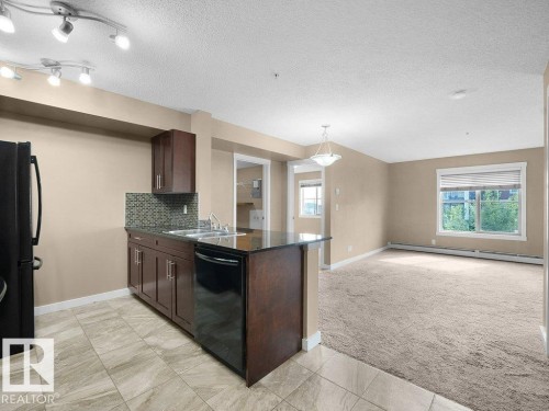 #307 5370 Chappelle Rd Sw, Edmonton, AB - Indoor Photo Showing Kitchen With Double Sink