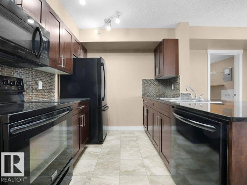 #307 5370 Chappelle Rd Sw, Edmonton, AB - Indoor Photo Showing Kitchen With Double Sink