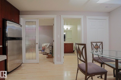 Light wood-finish flooring complements the interior space - 12 Douziech Close, St. Albert, AB - Indoor Photo Showing Dining Room