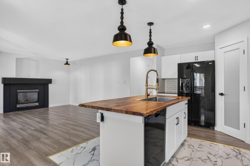 1315 Westerra Drive, Stony Plain, AB - Indoor Photo Showing Kitchen With Fireplace