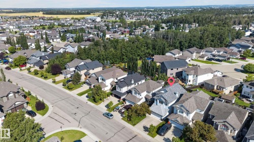 Suburban neighborhood setting with tree-lined streets and established landscaping - 1315 Westerra Drive, Stony Plain, AB - Outdoor With View