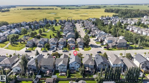 Aerial perspective of a residential neighborhood with a prominent green space - 1315 Westerra Drive, Stony Plain, AB - Outdoor With View