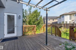 Wood deck with railing and pergola structure - 