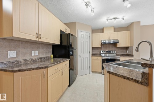 #60 1128 156 St Nw, Edmonton, AB - Indoor Photo Showing Kitchen With Double Sink