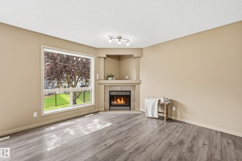 #60 1128 156 St Nw, Edmonton, AB - Indoor Photo Showing Living Room With Fireplace
