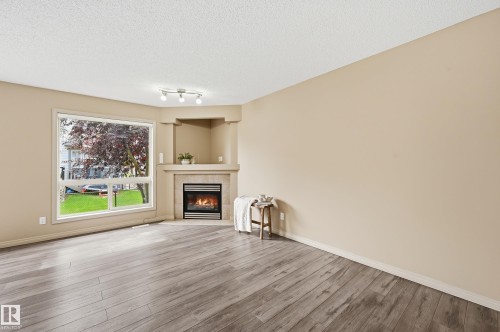 #60 1128 156 St Nw, Edmonton, AB - Indoor Photo Showing Living Room With Fireplace