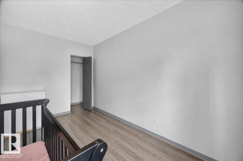 Wood-finish flooring with light gray walls and a closet with bifold doors - 543069 Range Road 191, Rural Lamont County, AB - Indoor