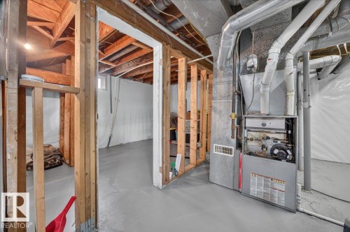 Unfinished basement with exposed wooden joists, concrete flooring, and visible utility systems - 543069 Range Road 191, Rural Lamont County, AB - Indoor Photo Showing Basement
