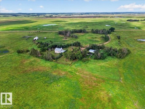 Expansive open pastures with natural water features and distant wooded areas - 543069 Range Road 191, Rural Lamont County, AB - Outdoor With View
