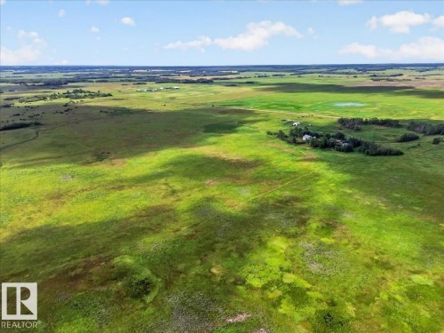 Expansive open land featuring green fields and distant structures - 543069 Range Road 191, Rural Lamont County, AB - Outdoor With View