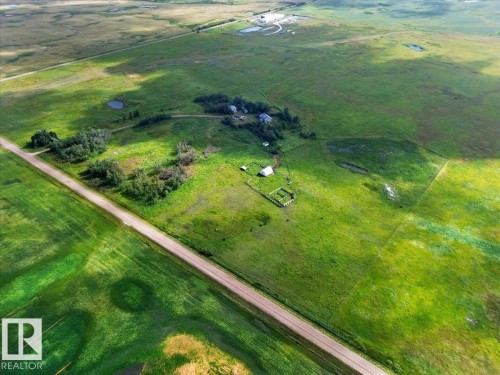 Expansive green acreage with a visible road, multiple structures, and scattered natural water features - 543069 Range Road 191, Rural Lamont County, AB - Outdoor With View
