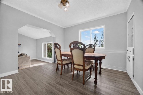 Wood-finish flooring throughout, light gray wall paint, and white trim molding - 543069 Range Road 191, Rural Lamont County, AB - Indoor Photo Showing Dining Room