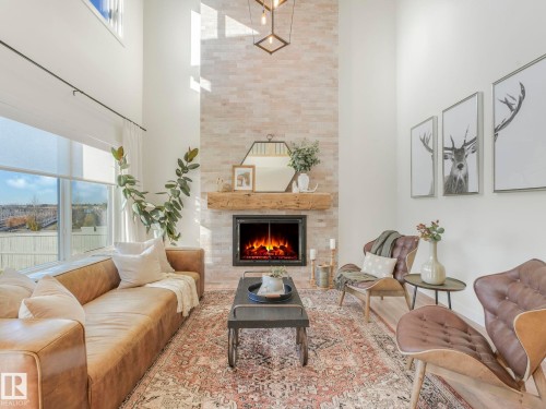 6613 62 Avenue, Beaumont, AB - Indoor Photo Showing Living Room With Fireplace