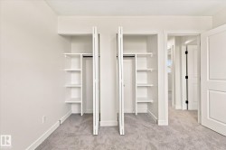 Dual custom built-in closets featuring integrated shelving and hanging rods - 