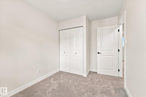 Neutral paint throughout - 18307 66 Avenue Nw, Edmonton, AB - Indoor Photo Showing Other Room