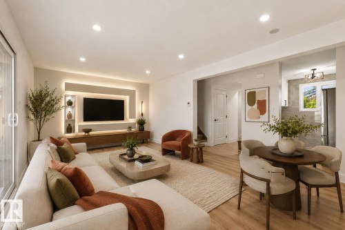 Recessed lighting throughout, custom built-in media center with accent lighting, light wood-finish flooring, sliding glass door, and an open concept layout - 18307 66 Avenue Nw, Edmonton, AB - Indoor