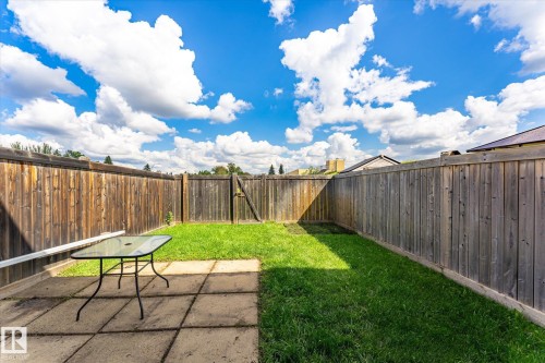 Fenced backyard featuring a paver patio and a lawn area - 18307 66 Avenue Nw, Edmonton, AB - Outdoor