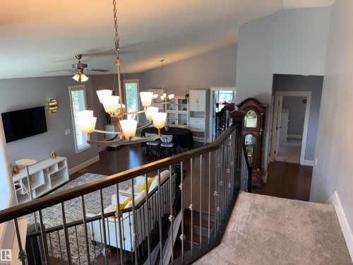 Vaulted ceiling with an overhead fan, hardwood flooring, and an open-concept layout - 1452 36A Avenue Nw, Edmonton, AB - Indoor Photo Showing Other Room