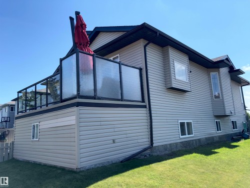 Exterior siding in a neutral tone with multiple windows providing natural light - 1452 36A Avenue Nw, Edmonton, AB - Outdoor With Exterior