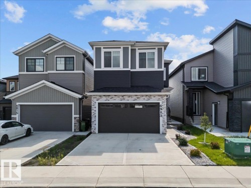 Modern facade featuring horizontal siding and stone accents - 6903 169 Avenue Nw, Edmonton, AB - Outdoor With Facade