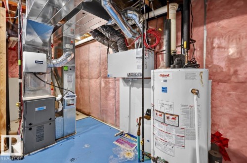 HVAC system with extensive ductwork, water heater, and a Lifebreath ventilation unit - 1529 26 Ave Nw Nw, Edmonton, AB - Indoor Photo Showing Basement