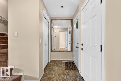 Panel door entrance with adjacent closet storage - 1529 26 Ave Nw Nw, Edmonton, AB - Indoor Photo Showing Other Room