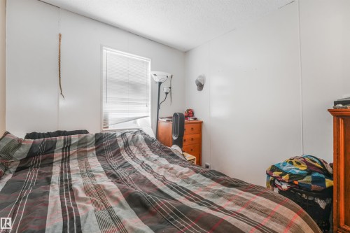 Additional content - 12209 94 Street Nw, Edmonton, AB - Indoor Photo Showing Bedroom
