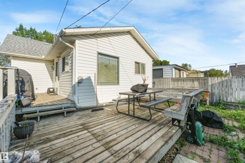 Expansive wooden deck with a privacy fence - 12209 94 Street Nw, Edmonton, AB - Outdoor With Deck Patio Veranda With Exterior