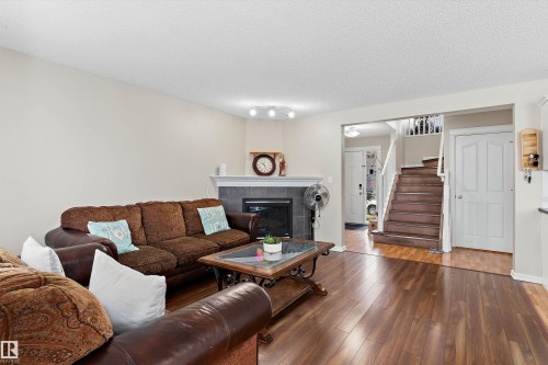8521 8 Avenue Sw, Edmonton, AB - Indoor Photo Showing Living Room With Fireplace