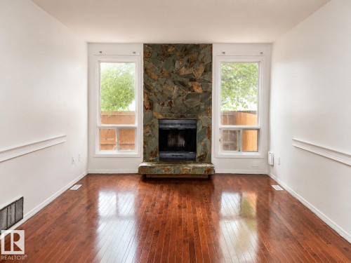 18625 66 Avenue Nw, Edmonton, AB - Indoor Photo Showing Living Room With Fireplace