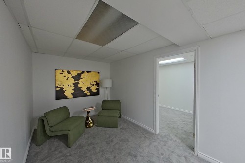 Recessed ceiling lighting, drop ceiling, light gray carpeting, white walls, white trim - #7 16823 84 St Nw Nw, Edmonton, AB - Indoor