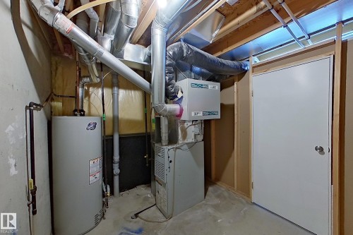 Water heater, furnace, and extensive ductwork - #7 16823 84 St Nw Nw, Edmonton, AB - Indoor Photo Showing Basement