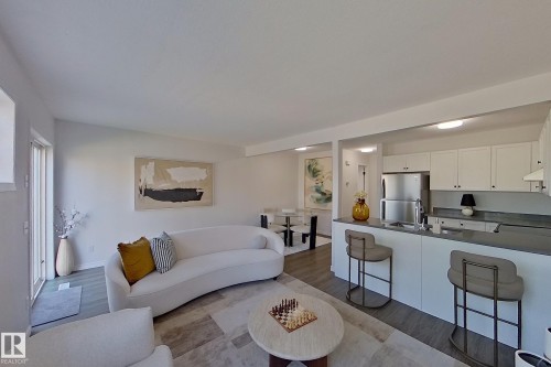 White cabinetry and stainless steel appliances - #7 16823 84 St Nw Nw, Edmonton, AB - Indoor