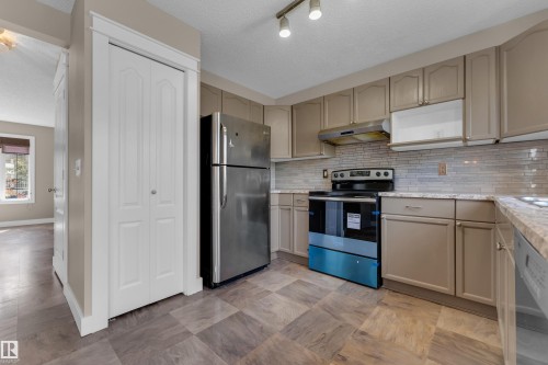 1434 Grant Way Nw, Edmonton, AB - Indoor Photo Showing Kitchen With Stainless Steel Kitchen