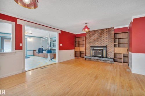 7604 149 Avenue Nw, Edmonton, AB - Indoor Photo Showing Living Room With Fireplace