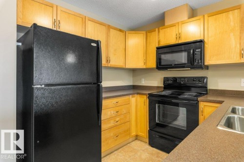 #203 5951 165 Av Nw, Edmonton, AB - Indoor Photo Showing Kitchen With Double Sink