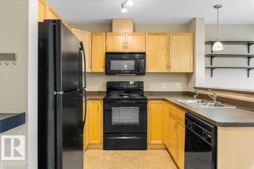 #203 5951 165 Av Nw, Edmonton, AB - Indoor Photo Showing Kitchen With Double Sink