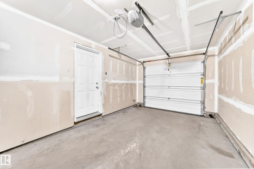#54 12050 17 Av Sw, Edmonton, AB - Indoor Photo Showing Garage
