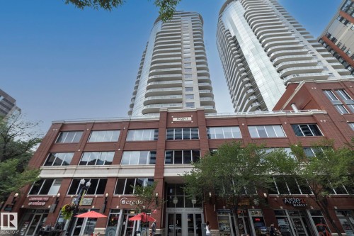Contemporary high-rise architecture with curved glass facades and private balconies - #1004 10136 104 St Nw, Edmonton, AB - Outdoor With Balcony With Facade