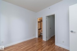 Wood-finish flooring with white baseboards - 