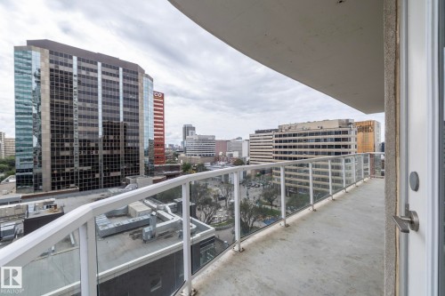 Curved concrete balcony featuring a glass and aluminum railing - #1004 10136 104 St Nw, Edmonton, AB - Outdoor With Balcony With View