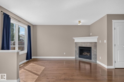 1107 177 Street Sw, Edmonton, AB - Indoor Photo Showing Living Room With Fireplace