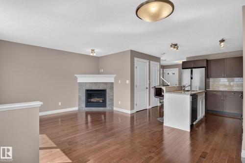 1107 177 Street Sw, Edmonton, AB - Indoor Photo Showing Kitchen With Fireplace