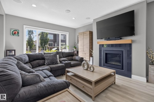 3617 Claxton Place Sw, Edmonton, AB - Indoor Photo Showing Living Room With Fireplace