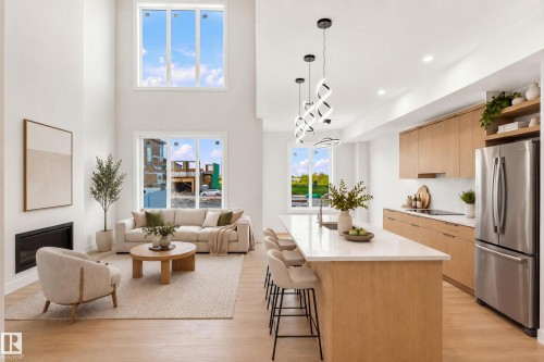 Open-concept living space with high ceilings and large windows - 1818 155 Avenue Nw, Edmonton, AB - Indoor Photo Showing Kitchen With Upgraded Kitchen