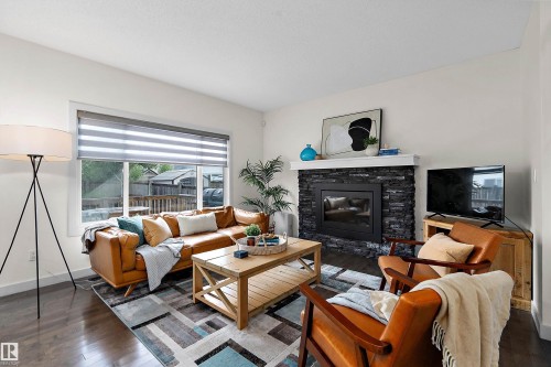 15832 11 Avenue Sw, Edmonton, AB - Indoor Photo Showing Living Room With Fireplace