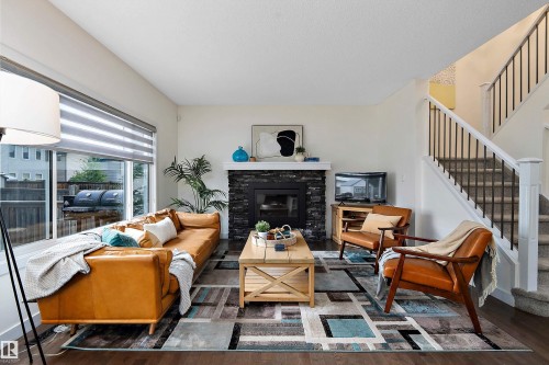 15832 11 Avenue Sw, Edmonton, AB - Indoor Photo Showing Living Room With Fireplace