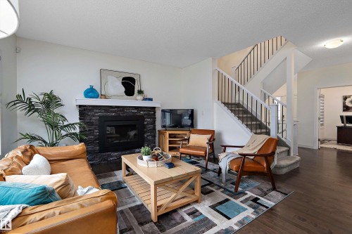 15832 11 Avenue Sw, Edmonton, AB - Indoor Photo Showing Living Room With Fireplace